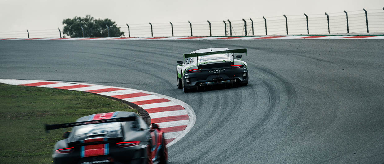 Two Porsche GT on race track