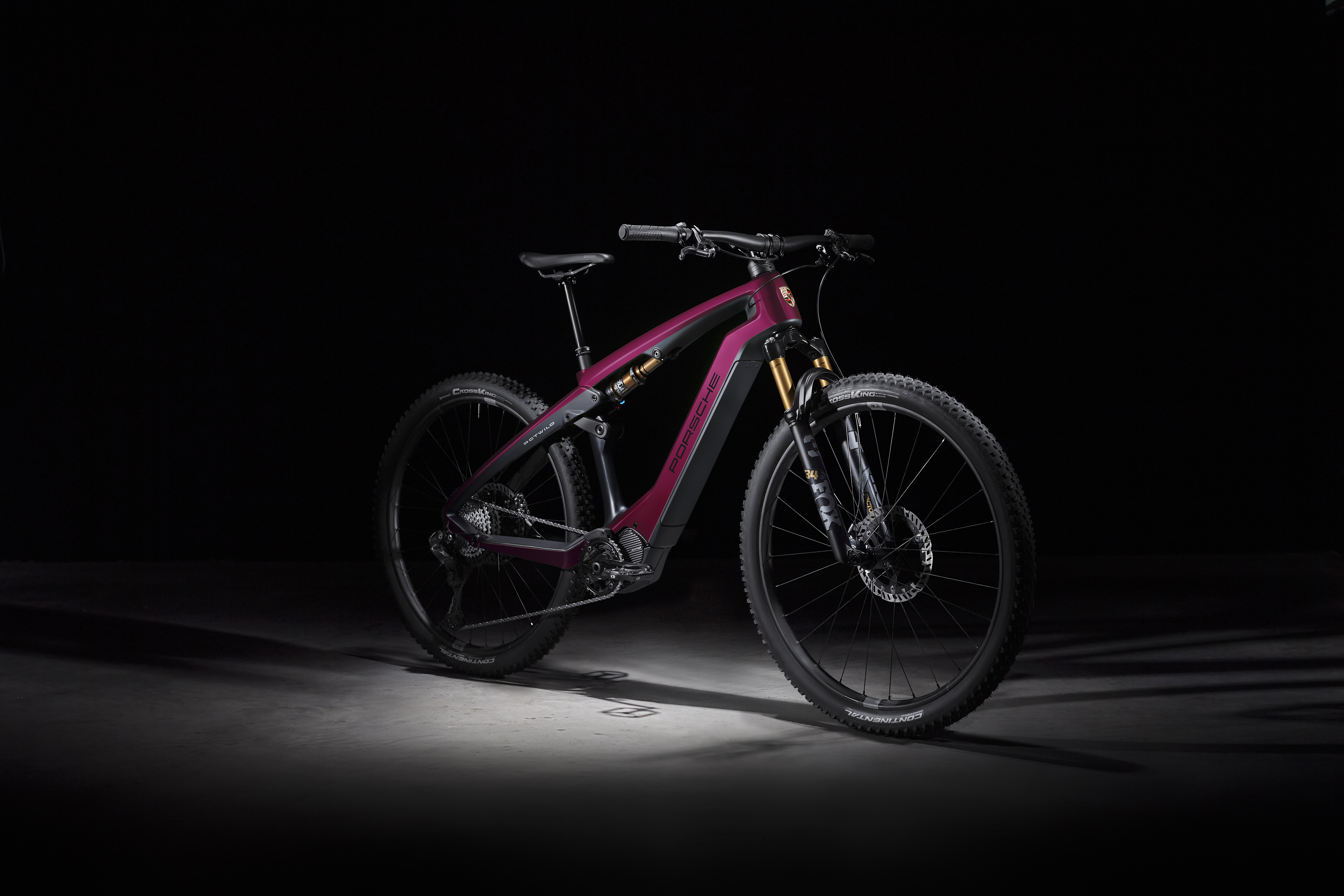 A Porsche eBike Cross Performance EXC model in the colour Star Ruby Neo