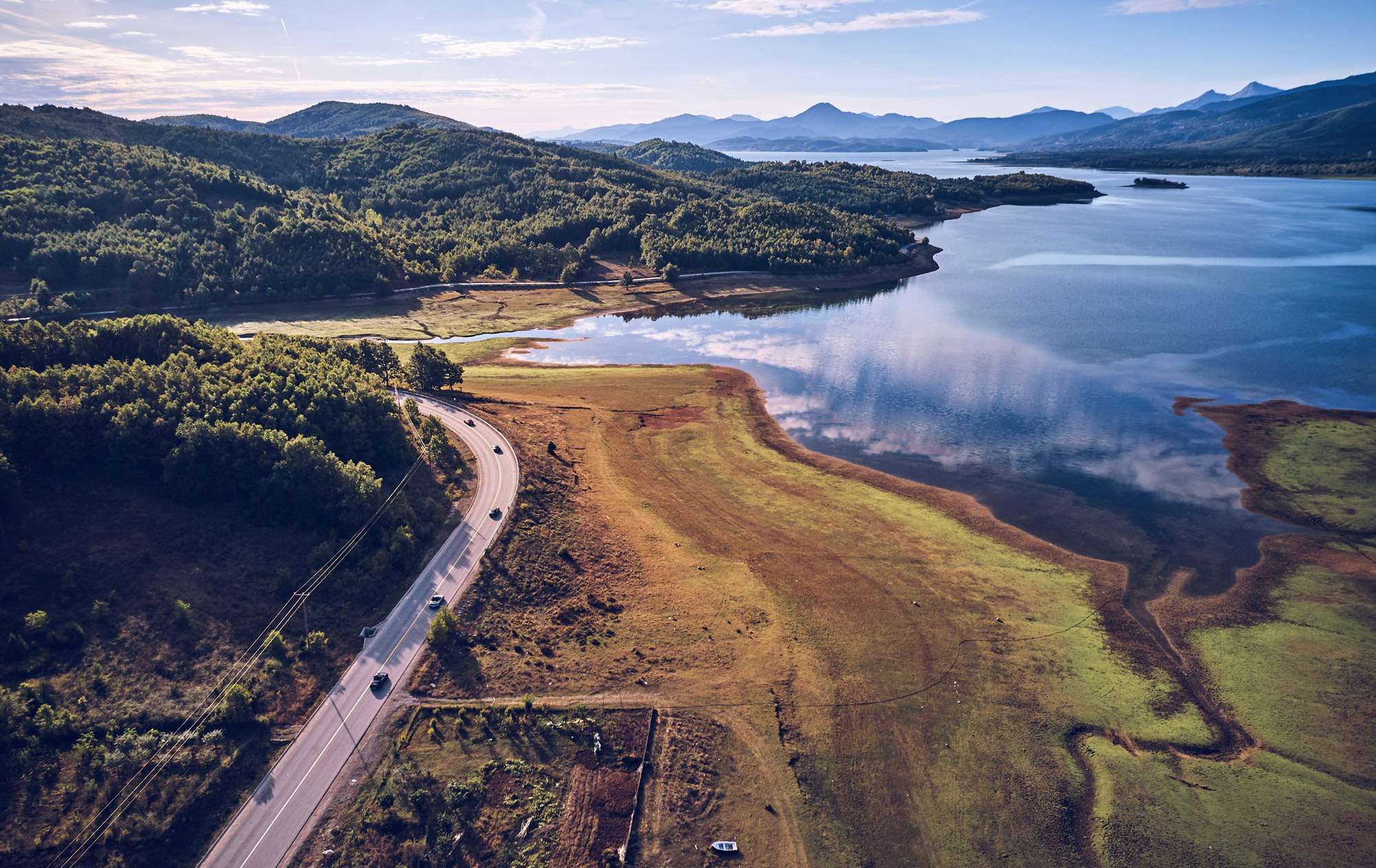 Aerial view of landscape with water and mountains