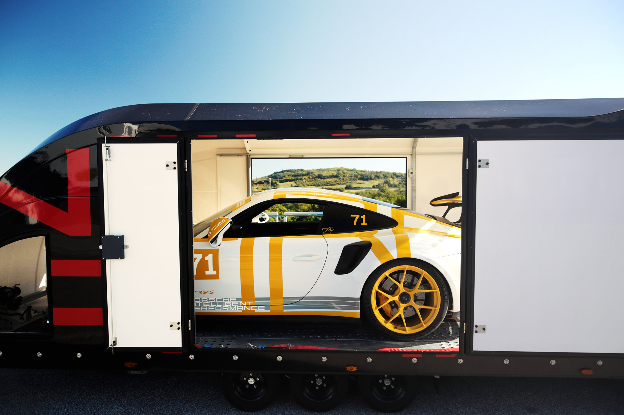 Porsche 911 GT3 RS loaded on a van