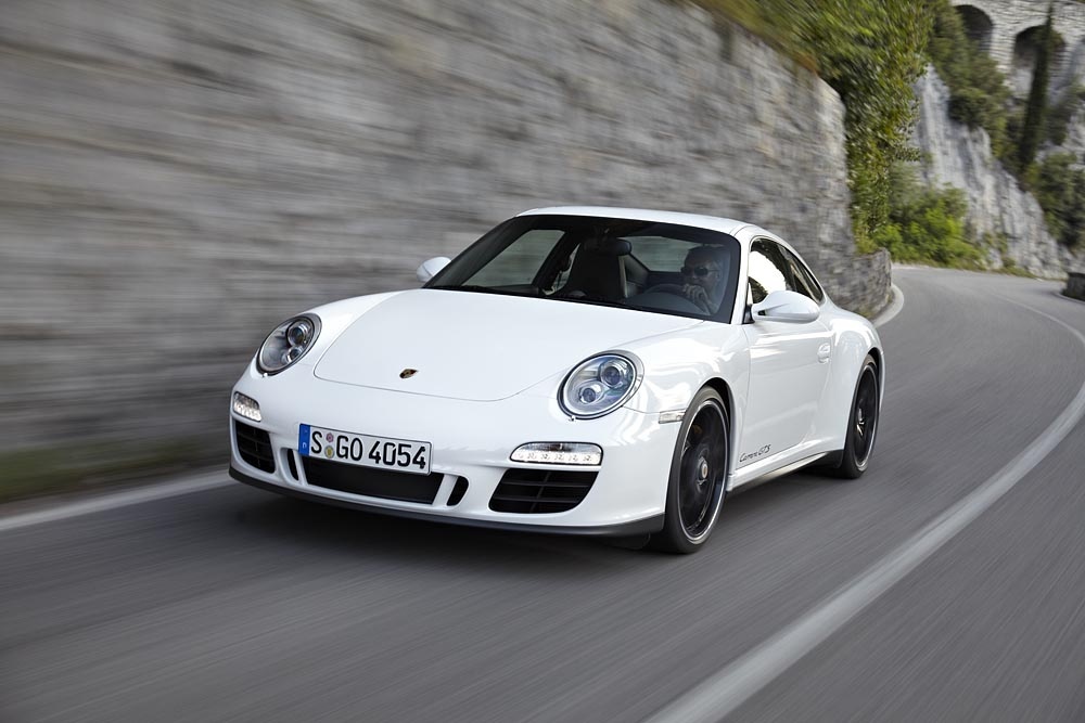 Porsche 911 GTS driving on a road