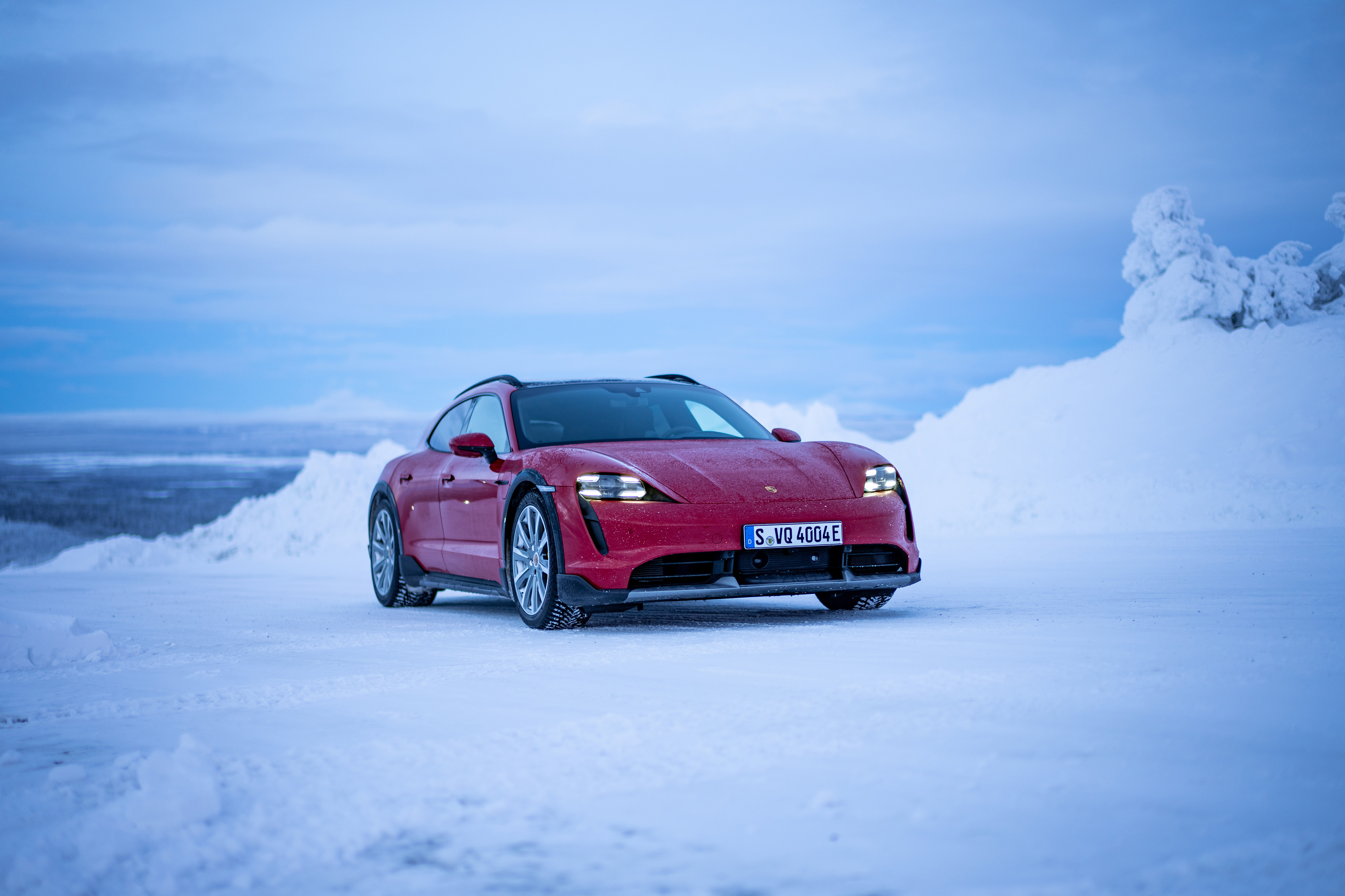 Red Taycan Cross Turismo in a snowy Finnish landscape