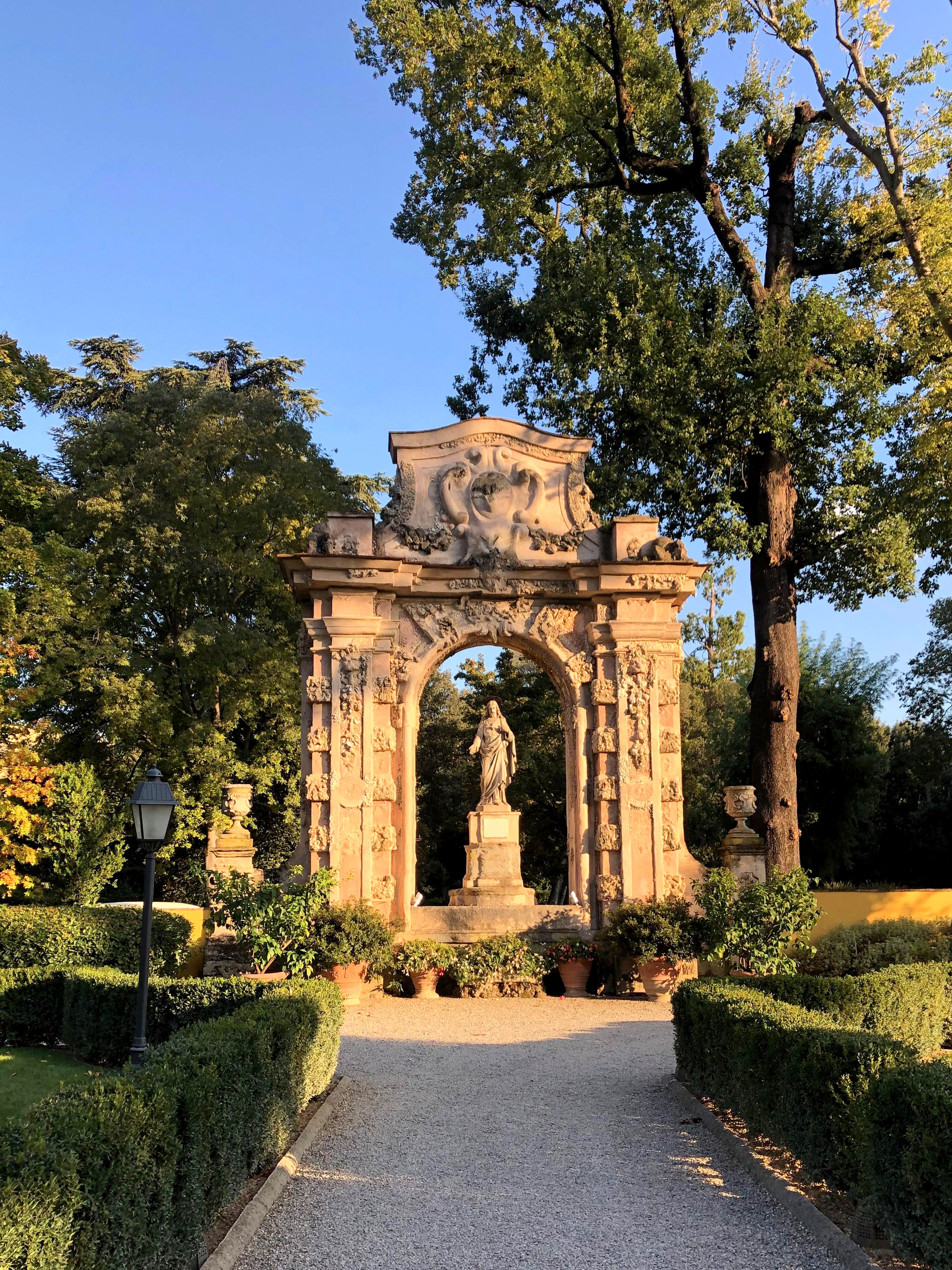 Arch and statue in park at Four Seasons Hotel Florence