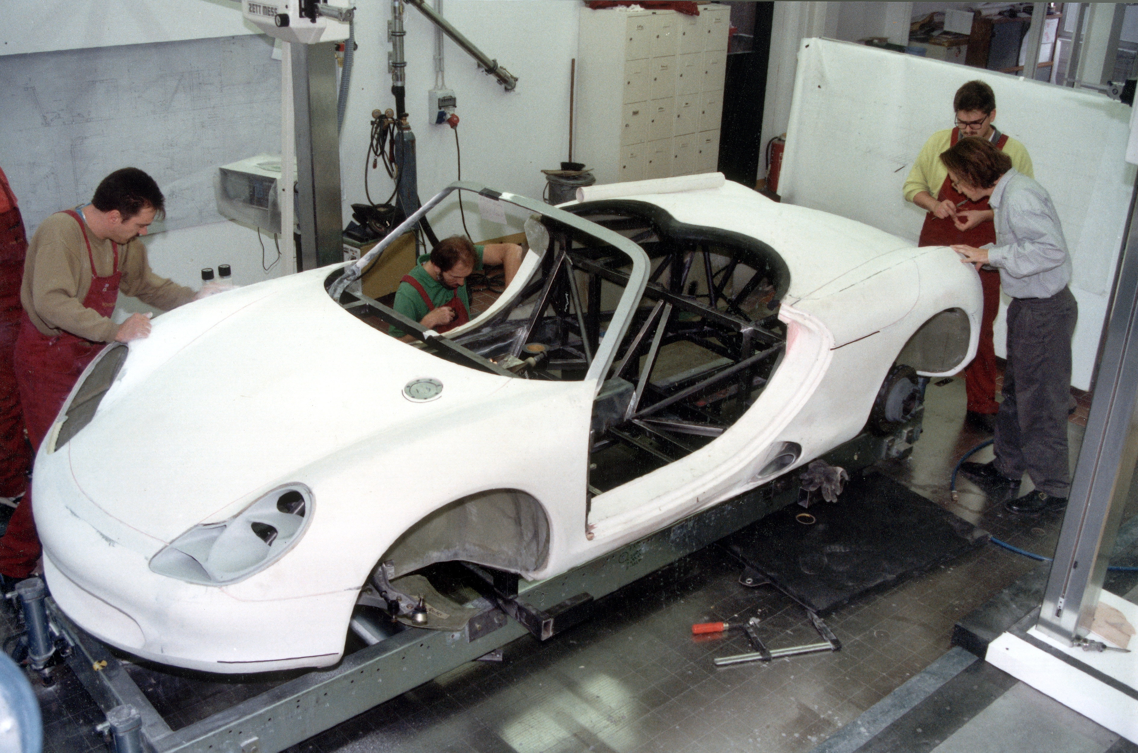Engineers and designers working on Boxster concept in the workshop