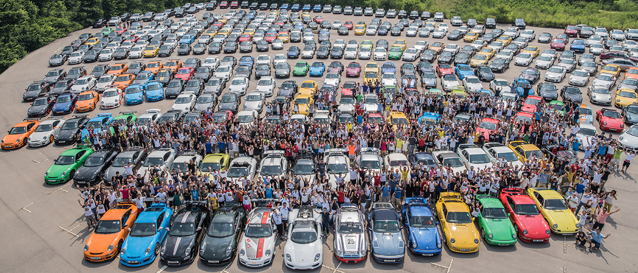 Large gathering of Porsche fans with cars