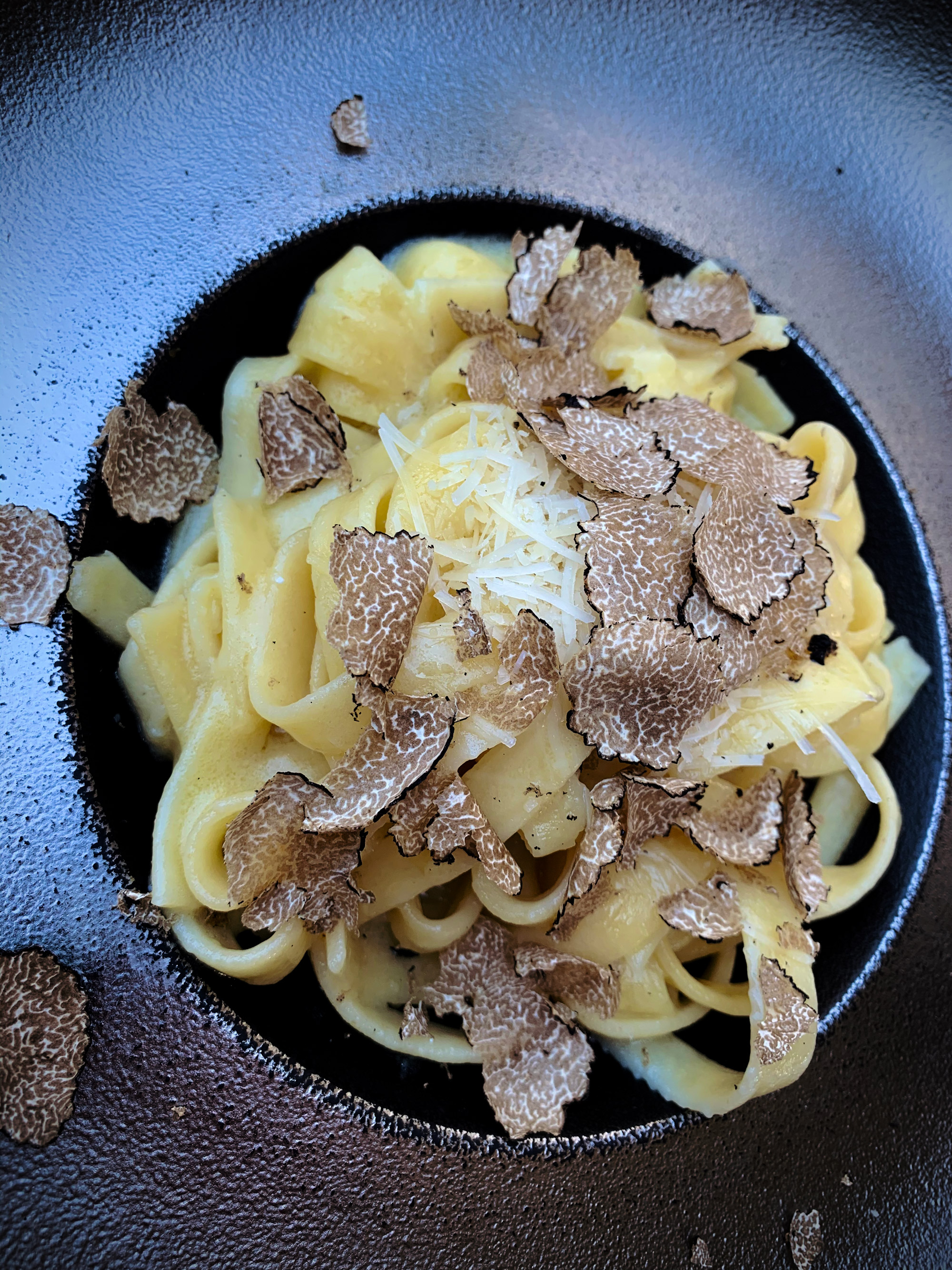 White truffle shaved over bowl of ice cream