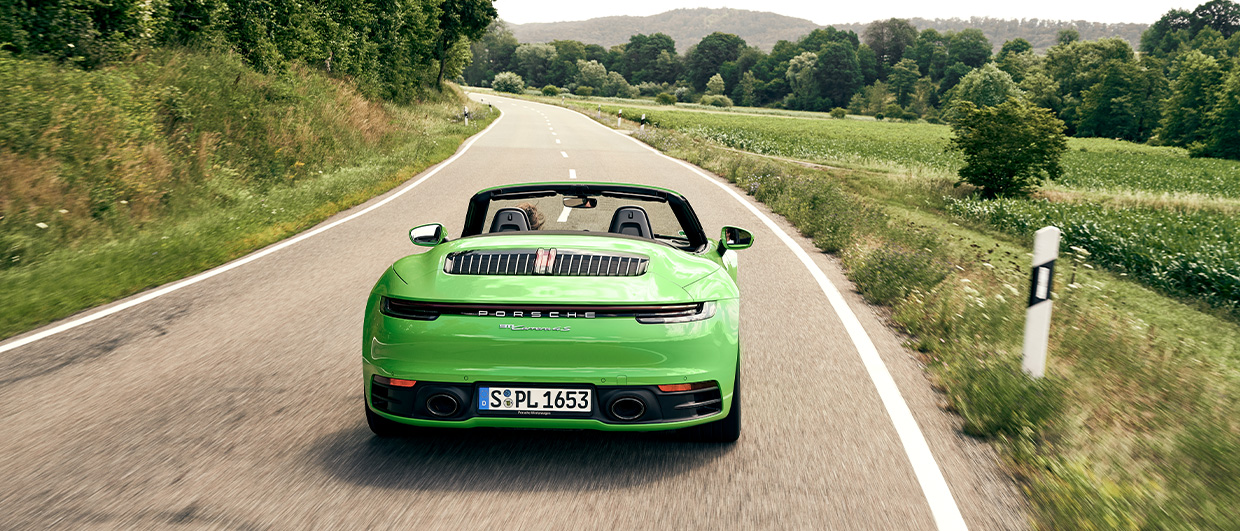 Green Porsche 911 Carrera 4 S Cabriolet on country road