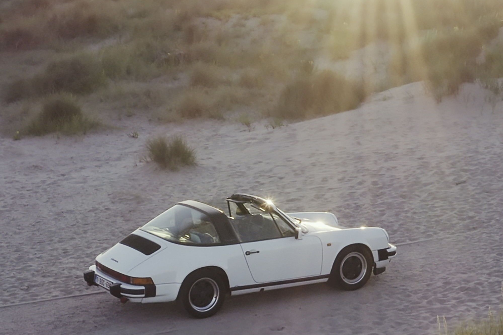The family hits the road at the first sunny opportunity in their white 911 Targa