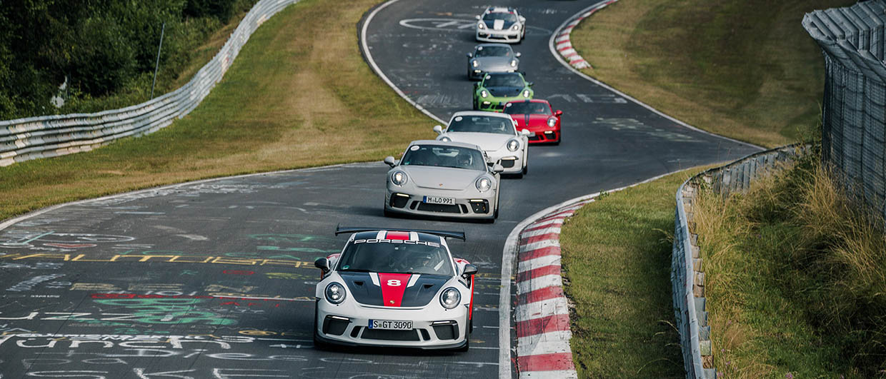 Porsche cars on racetrack