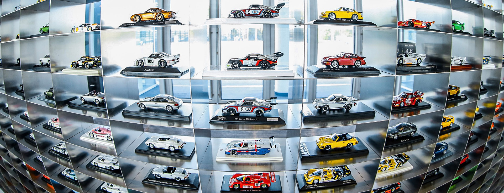 Line-up of Porsche model cars on display