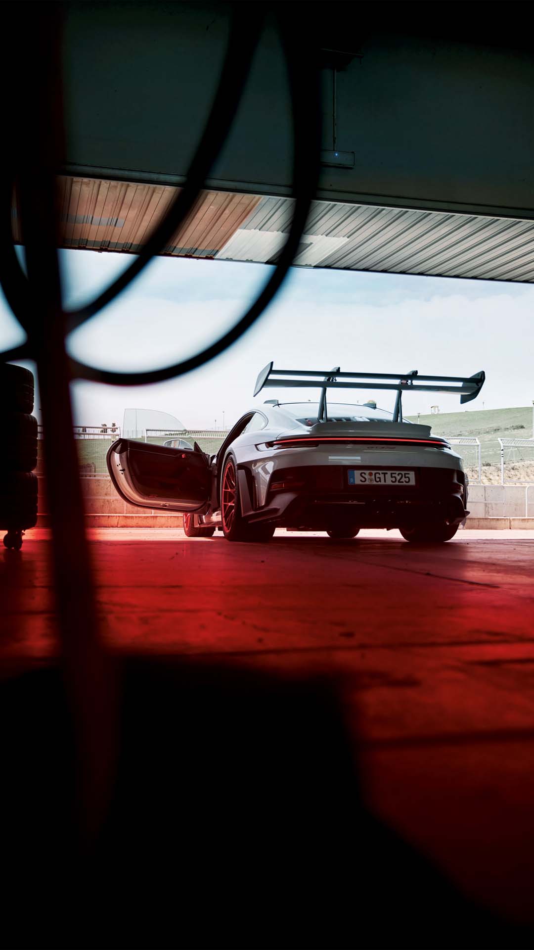 Porsche 911 GT3 RS parked in pits racetrack wallpaper mobile 5