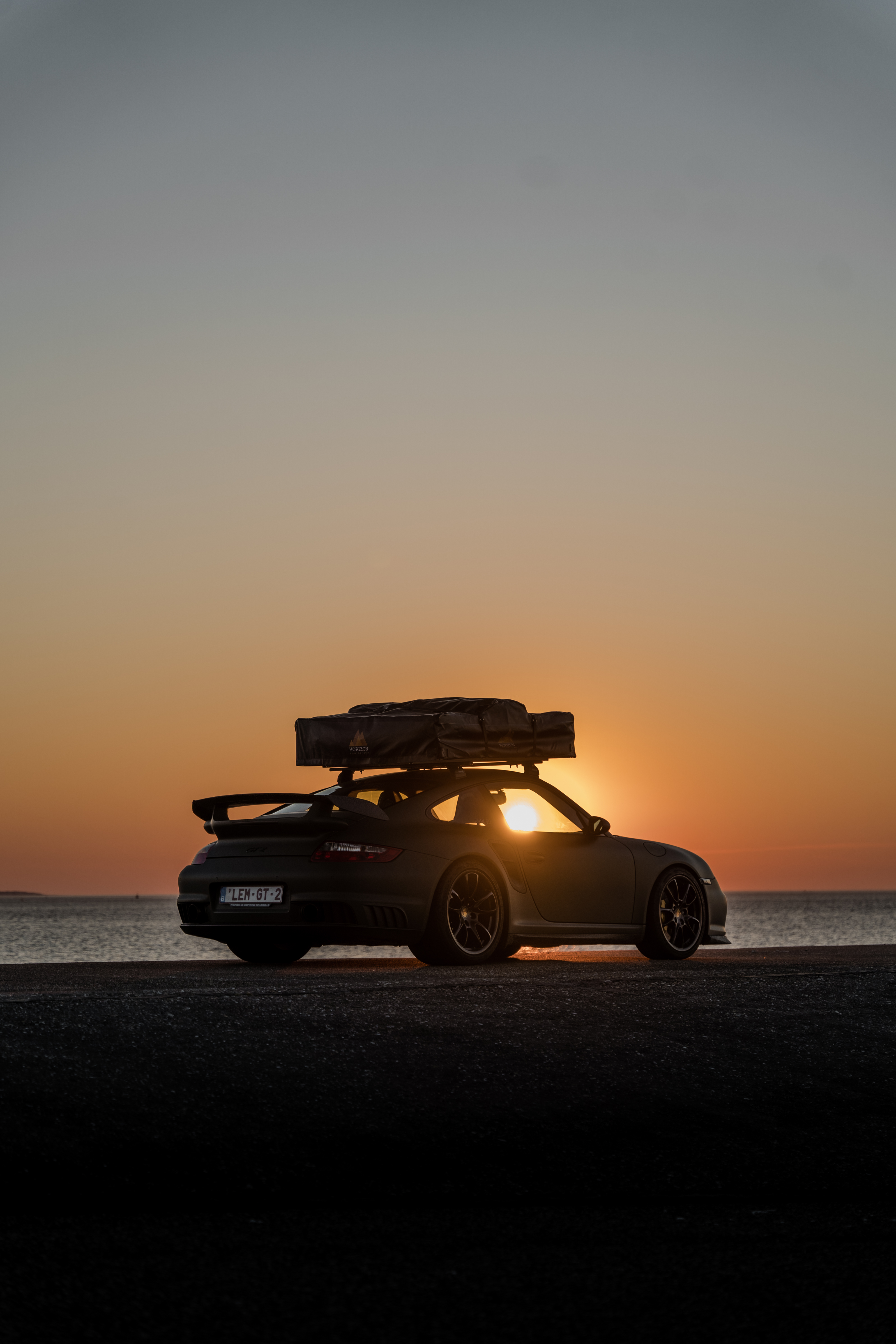 2008 Porsche 911 (997) GT2 with rooftent in sunset silhouette