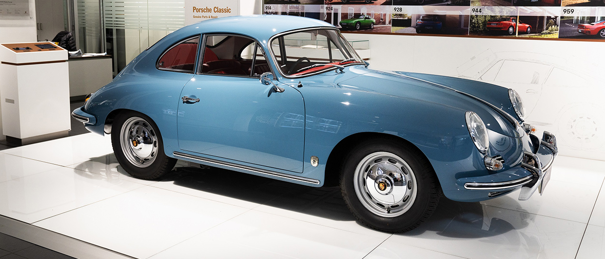 Blue Porsche 356 coupé in Porsche Classic dealership