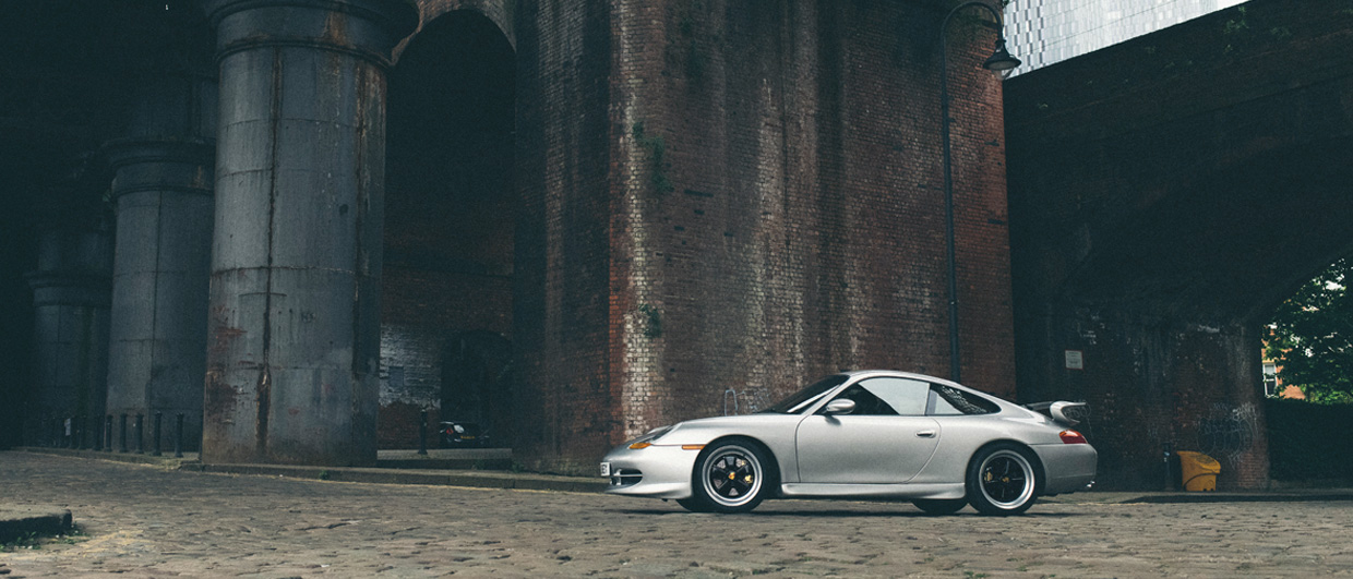 911 (996) with Porsche Classic Fuchs rims on cobbled streets