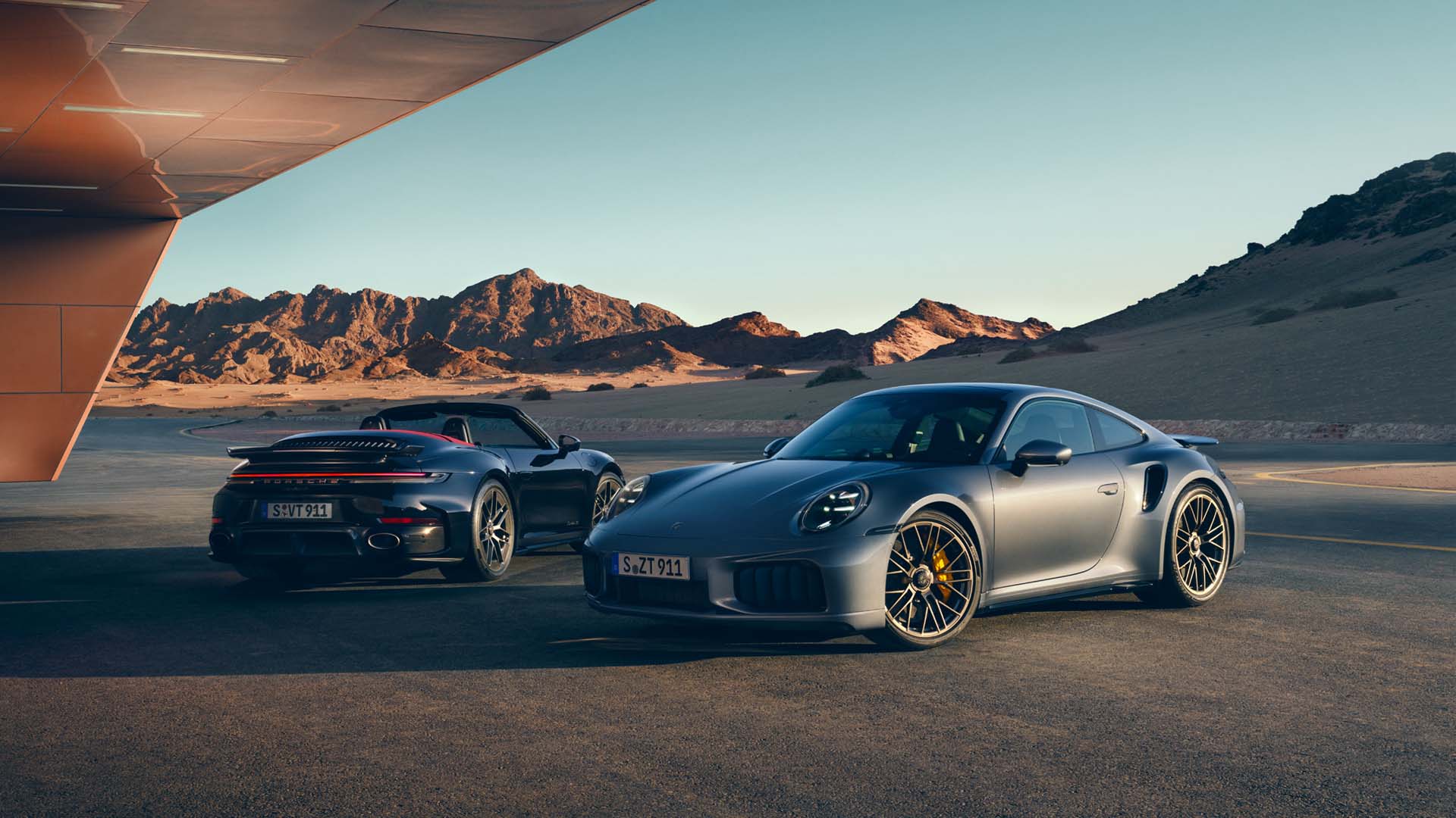 Porsche 911 Turbo S coupe and cabriolet parked side by side 