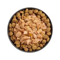 Bowl of kibble topped with Go! Booster Joint Care Minced Chicken recipe for dogs