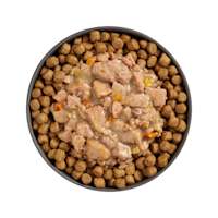 Bowl of kibble topped with Go! Booster Digestive Health Minced Chicken + Duck recipe for cats
