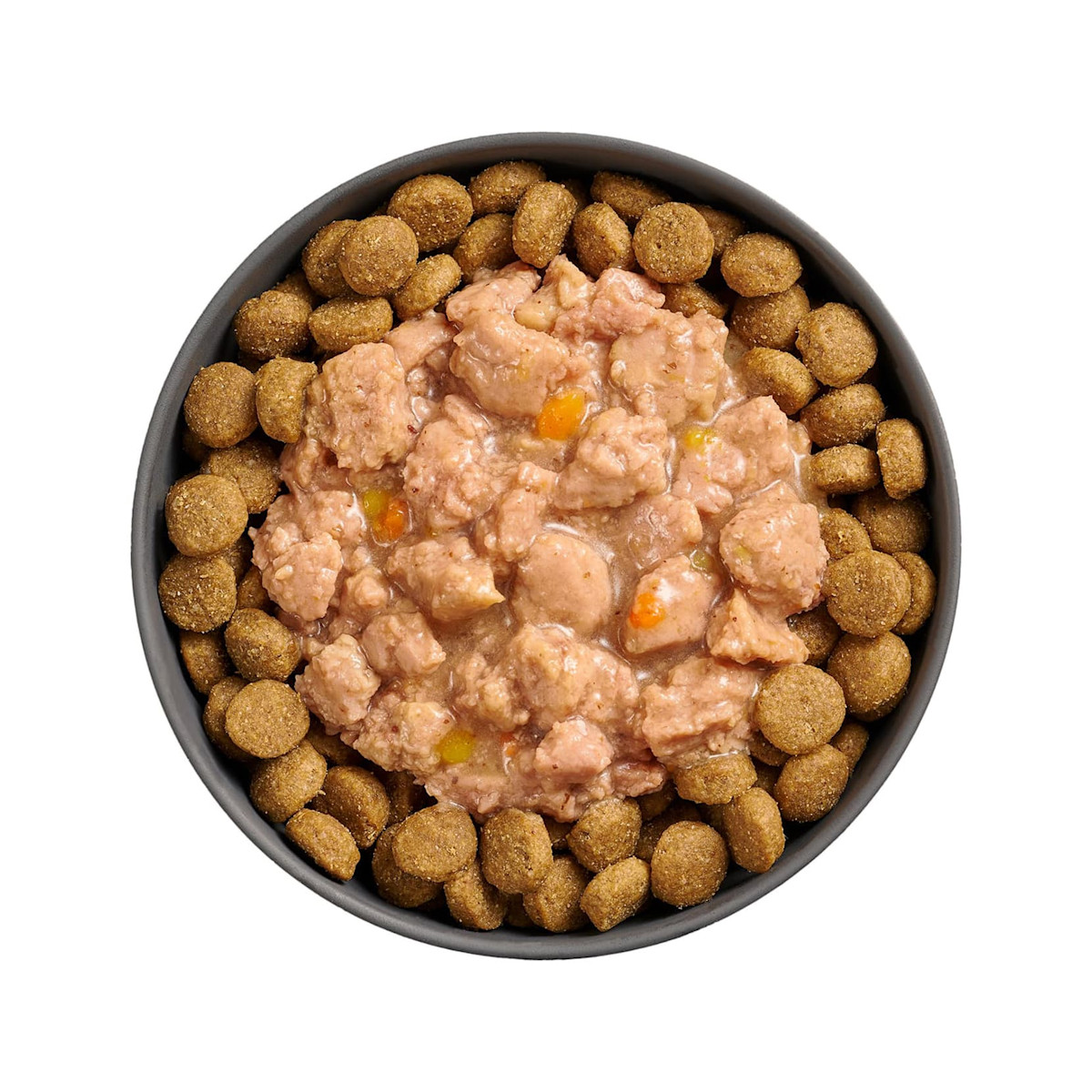 Bowl of kibble topped with Go! Booster Tranquility Minced Chicken recipe for dogs