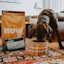 Dog eating beside bag of Now Fresh large breed senior dog food