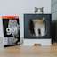 Cat in litterbox beside bag of Go! Hairball Control + Urinary Care cat food