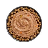 Bowl of kibble topped with Go! Booster Brain Health Tuna + Salmon Pâté recipe for cats