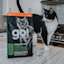 Black and white cat on kitchen counter with back of Go! Solutions kibble