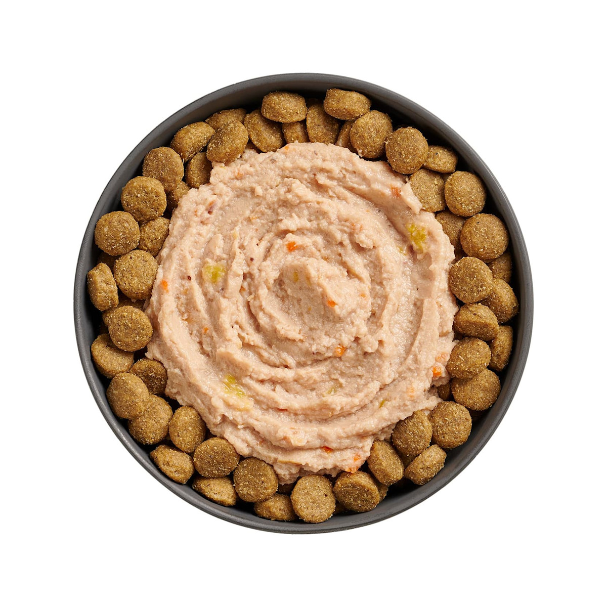 Bowl of kibble topped with Go! Booster Joint Care Chicken, Salmon + Duck Pâté for dogs