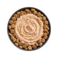 Bowl of kibble topped with Go! Booster Joint Care Chicken, Salmon + Duck Pâté for dogs