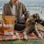 Dog and owner on picnic with bag of Now Fresh adult dog food