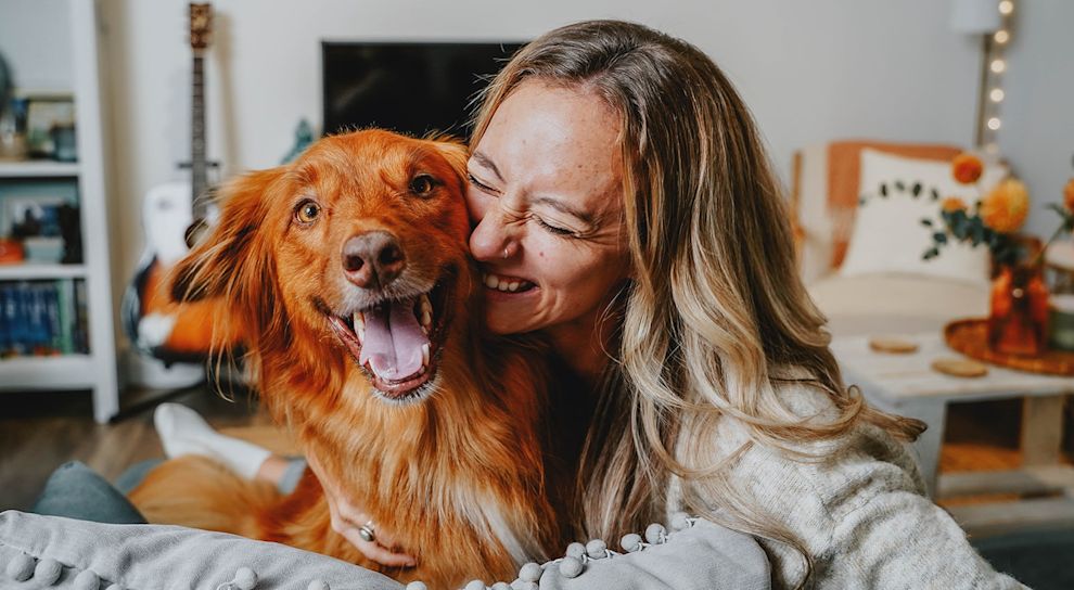 Woman hugging dog