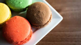 Four macarons on a plate