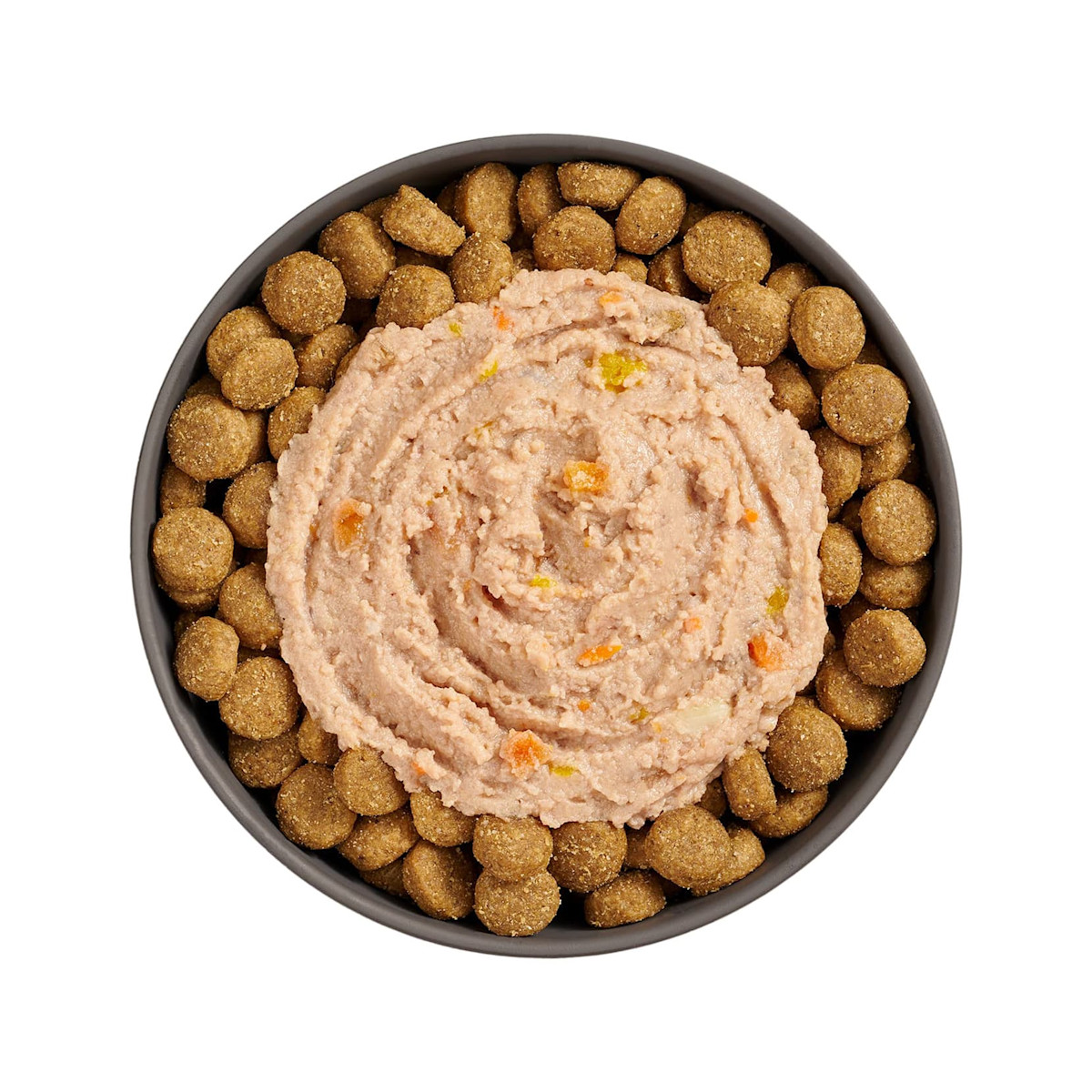 Bowl of kibble topped with Go! Booster Digestive Health Chicken + Duck Pâté for dogs