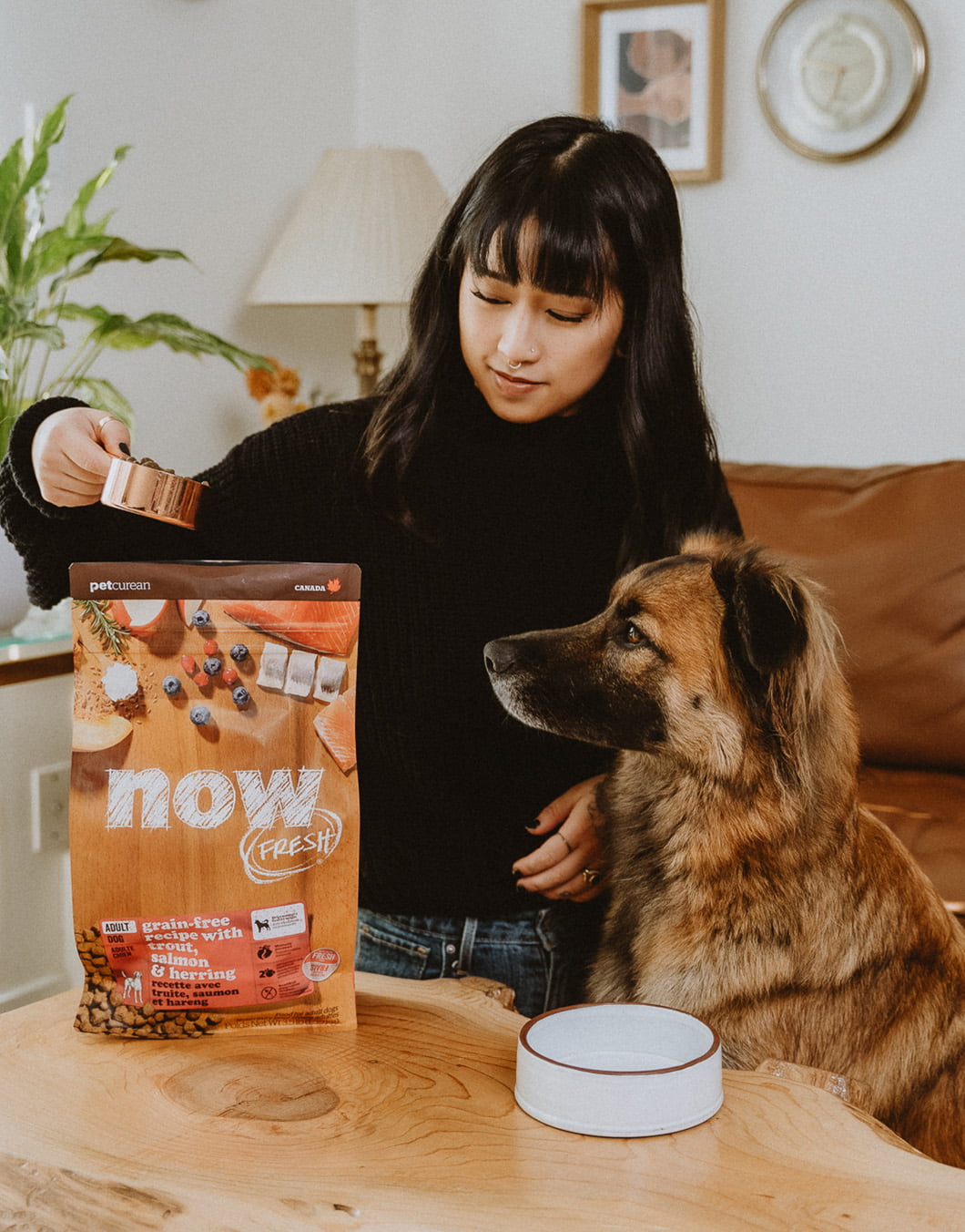 Dog watching woman scoop NOW FRESH kibble