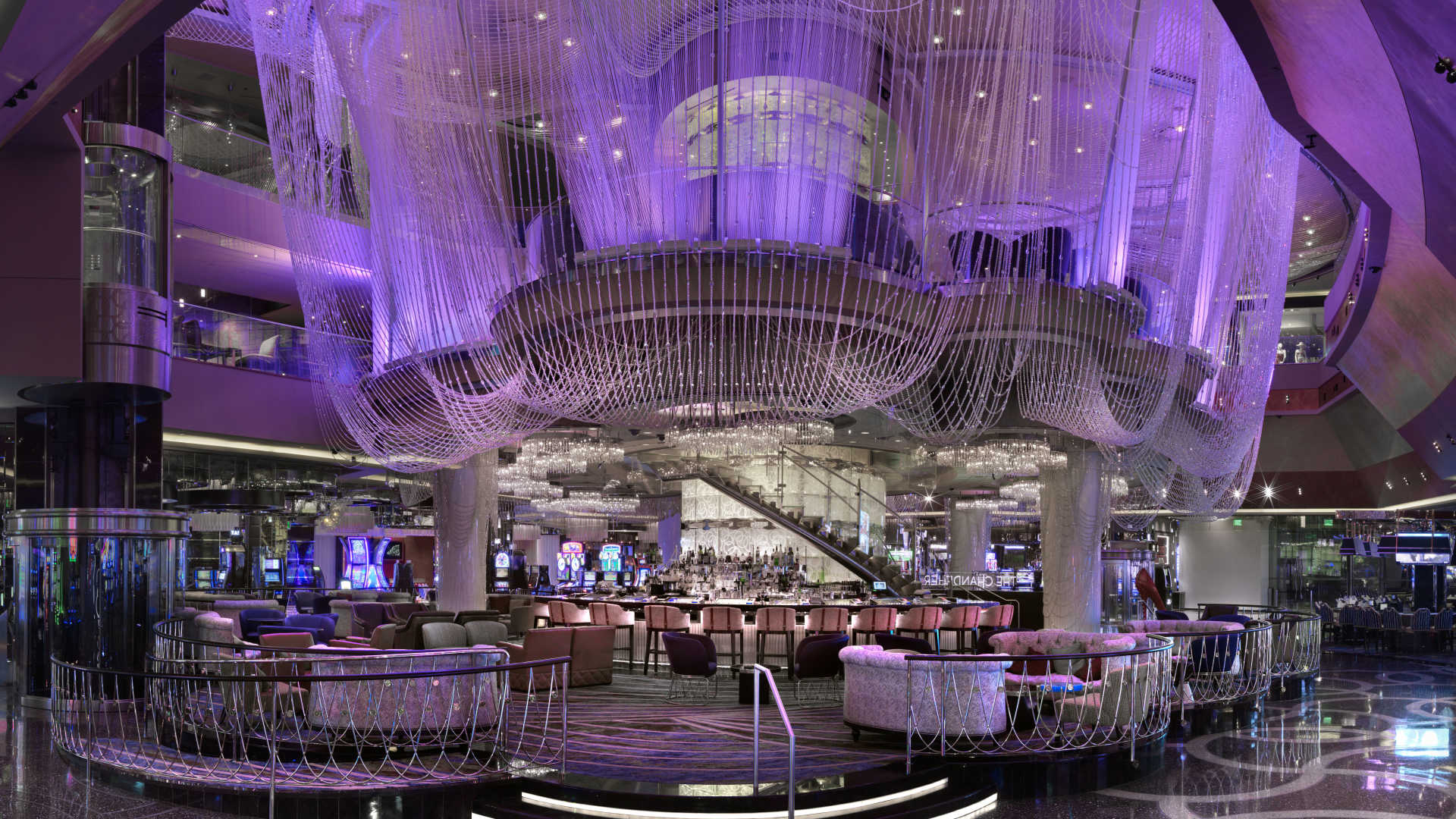 Casino cocktail lounge with purple light on bottles lyrics