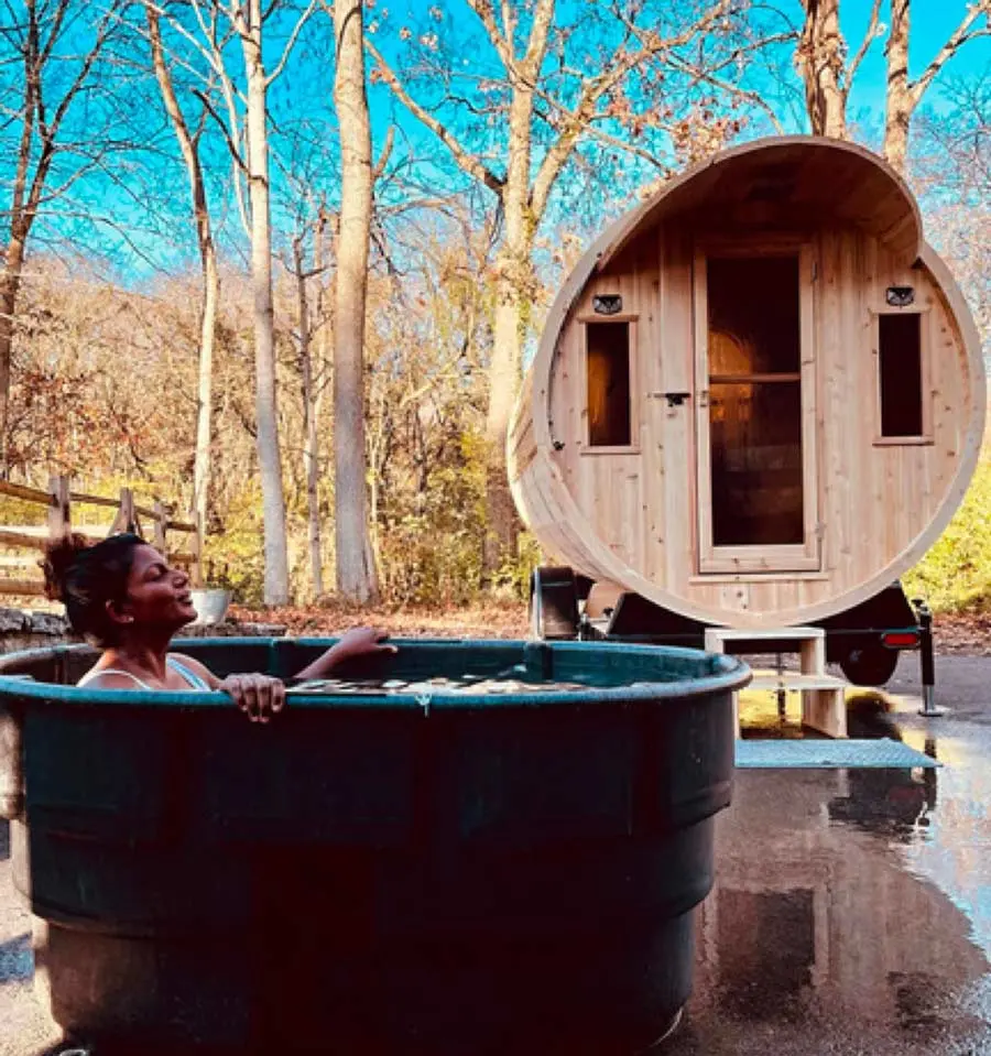 Woman Enjoying a Cold Plunge after the Hooga Sauna