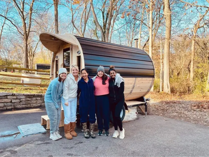 Family Standing in front of a Traveling Hooga 