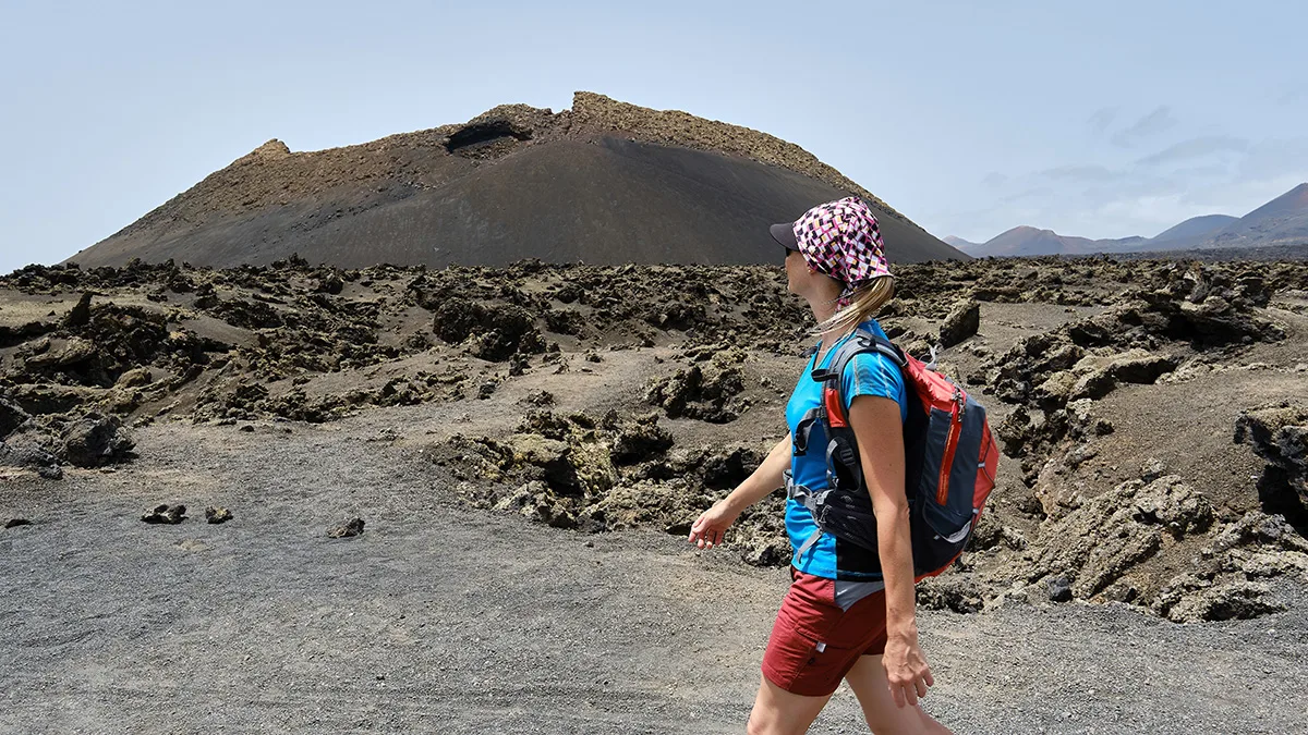 Hiking to El Cuervo Volcano. Credit: Shutterstock