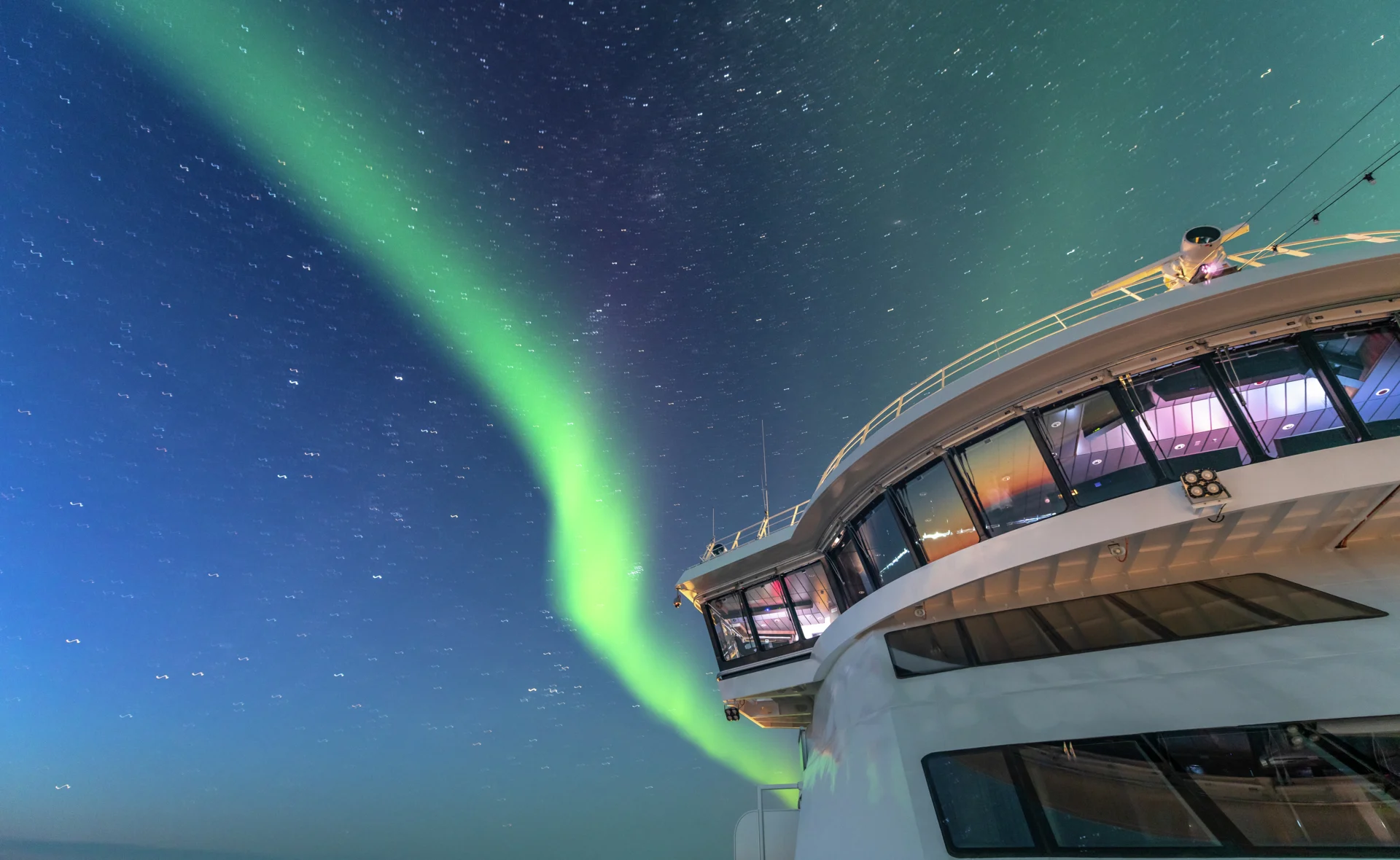 The Northern Lights are dancing in the sky above the bridge of MS Roald Amundsen in Canada. Credit: Karsten Bidstrup.