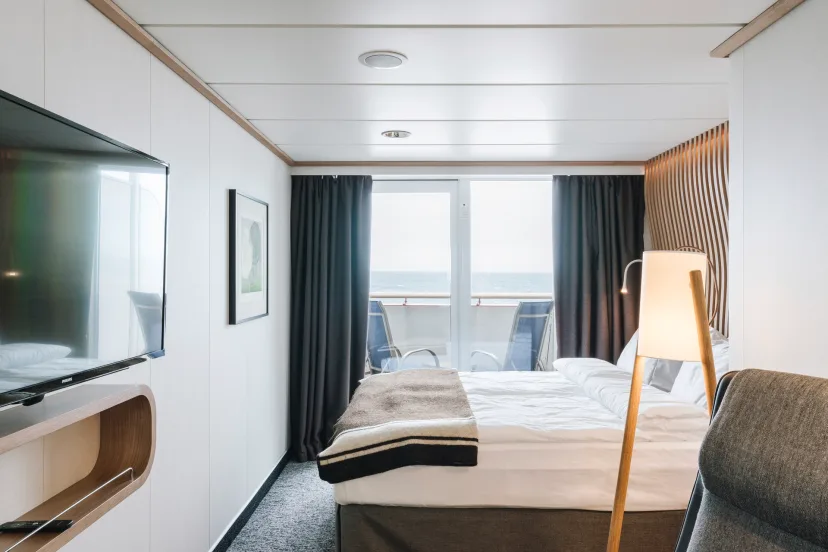 Bedroom in an Arctic Superior cabin (XT) onboard MS Fridtjof Nansen. Credit: Clara Tuma