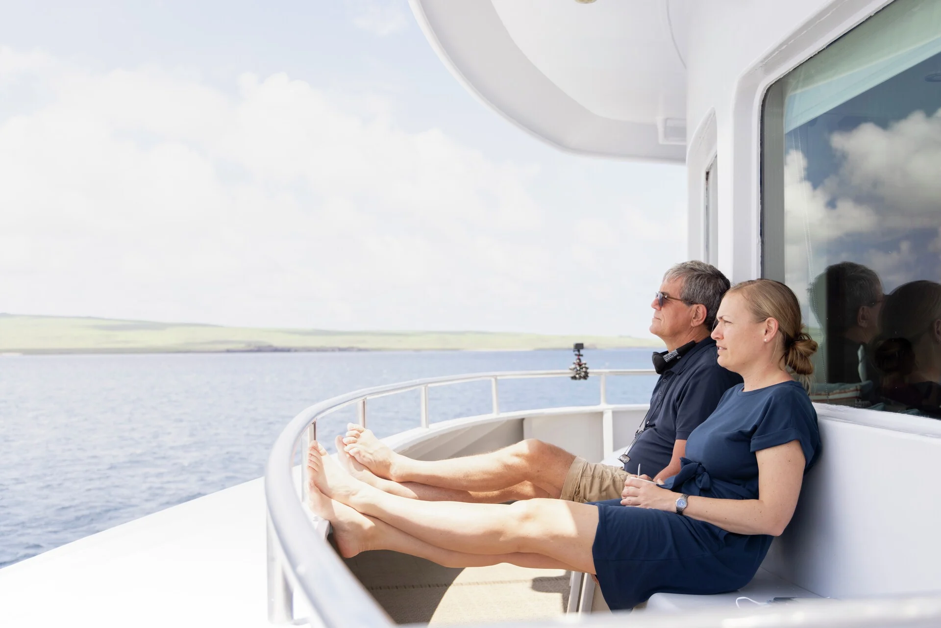 Guests relaxing on the Sky Deck onboard MS Santa Cruz II. Credit Ashton Ray Hansen.