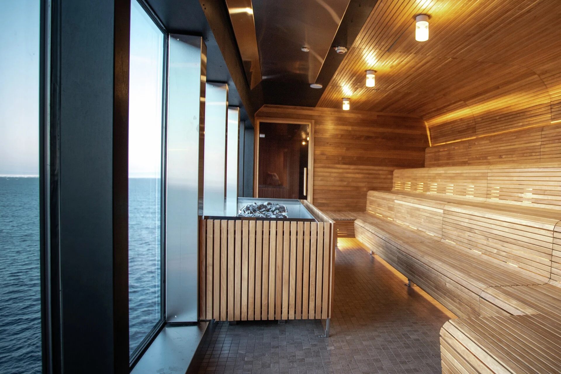 Enjoy the sauna onboard MS Roald Amundsen with its panoramic view over the open sea. Credit: Oscar Farrera