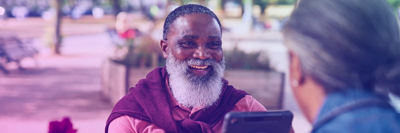 African man smiling An African man smiling at the woman sitting opposite him
