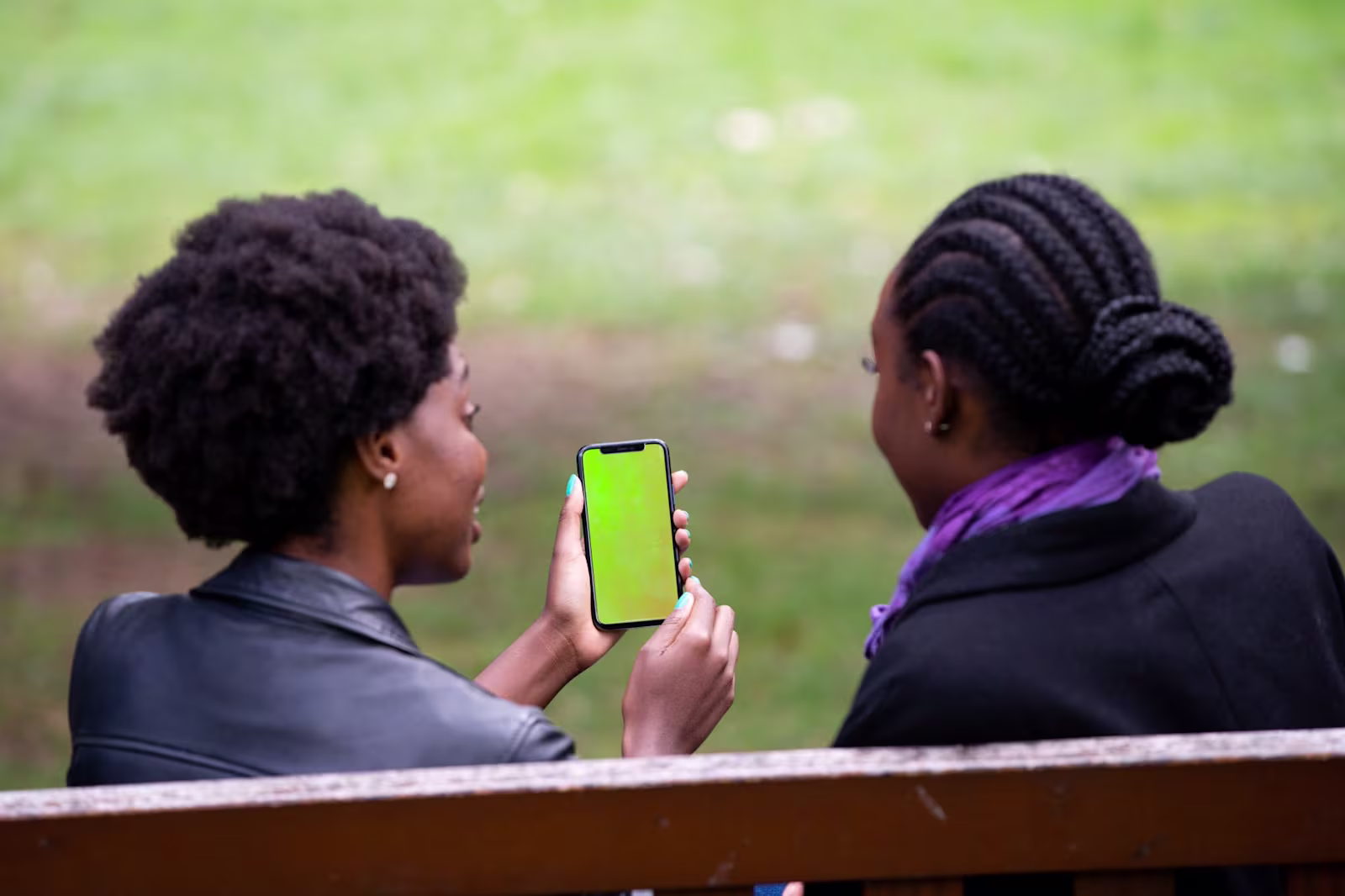 Park bench A photo of the back of two women sitting on a park bench