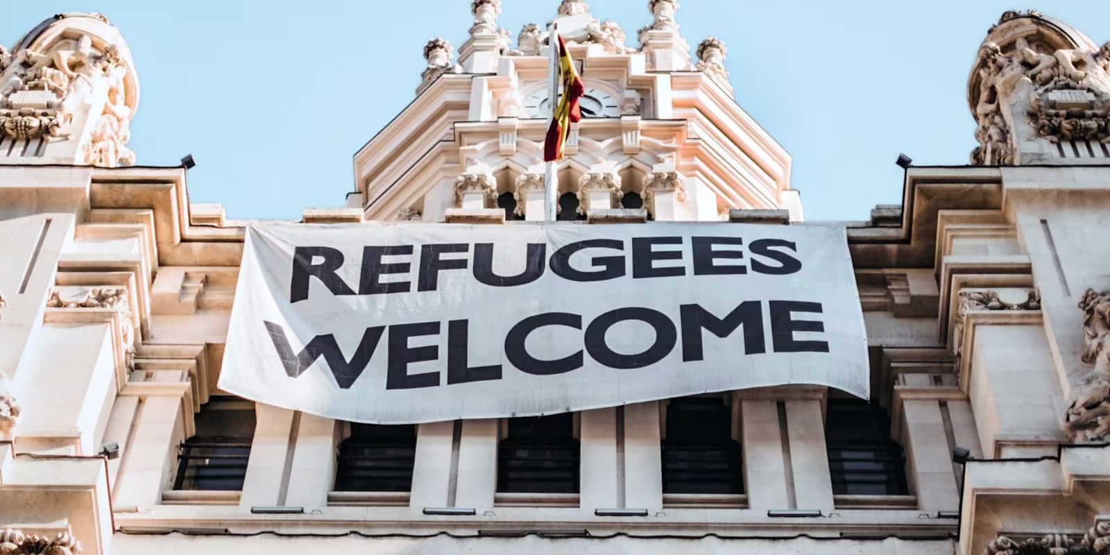 Refugees Day Banner Refugees Welcome Banner on building