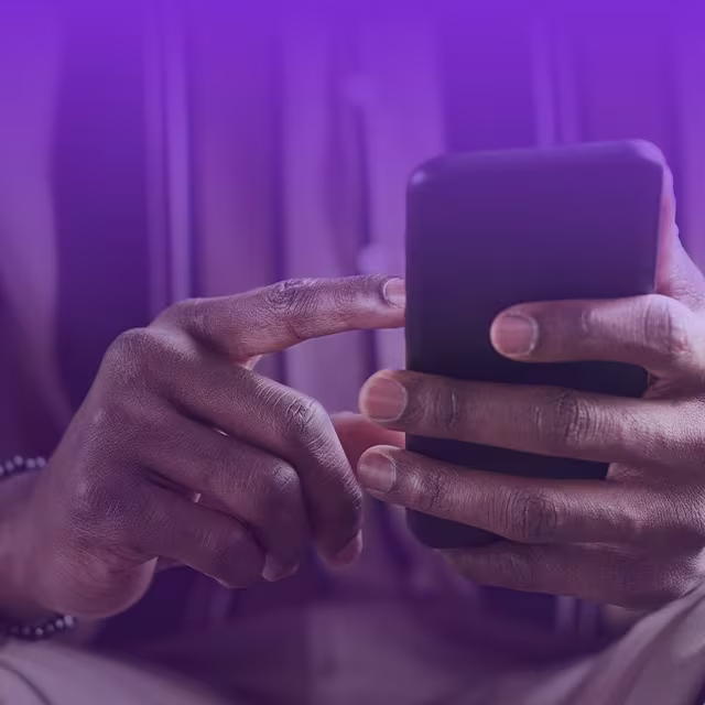 Security-mobile An image of someone's hands, using their iPhone