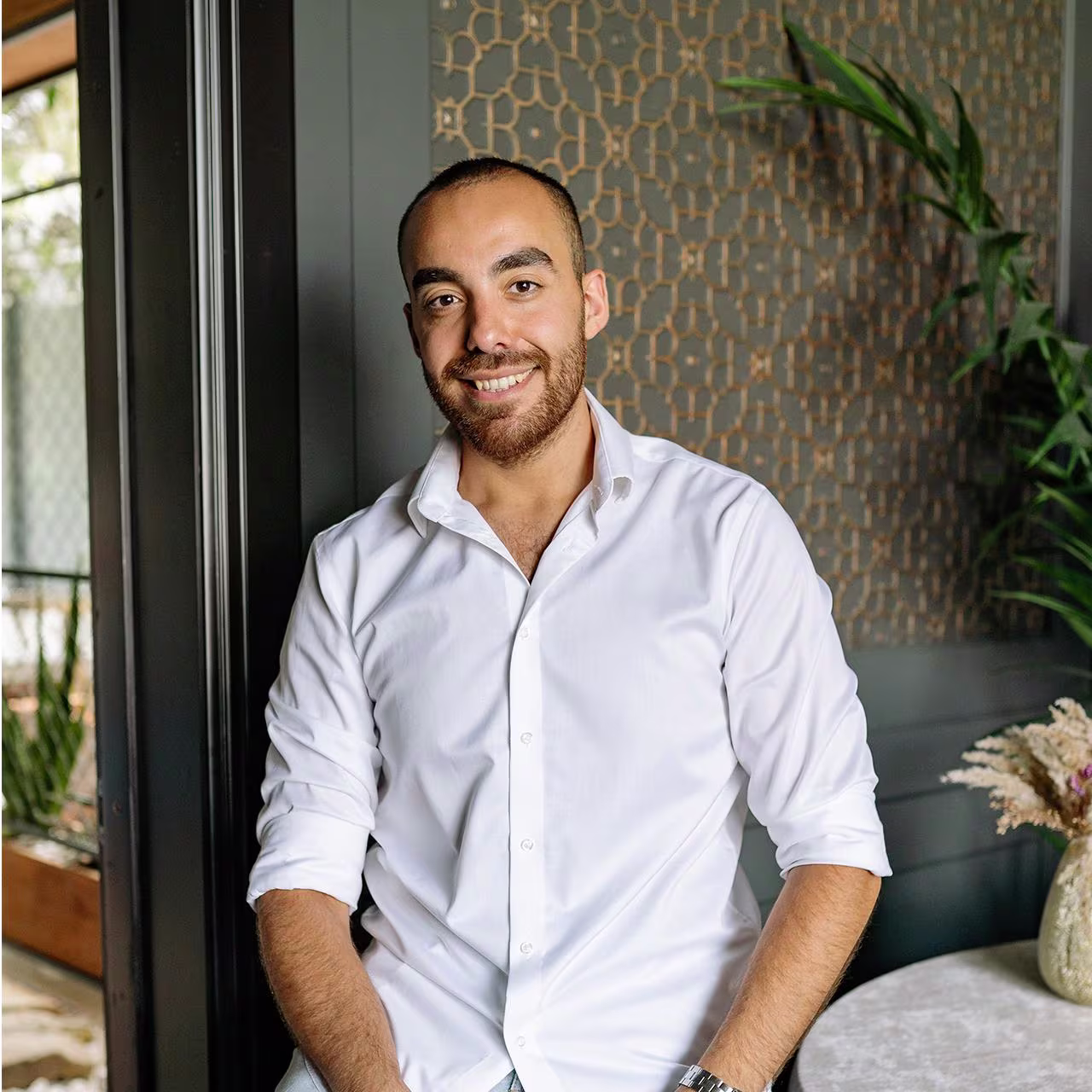 Morocco - How much does it cost to send money banner A photo of a Moroccan man smiling