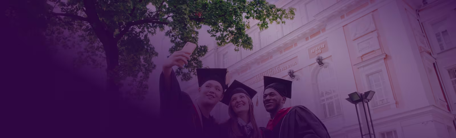 Three graduates taking a selfie