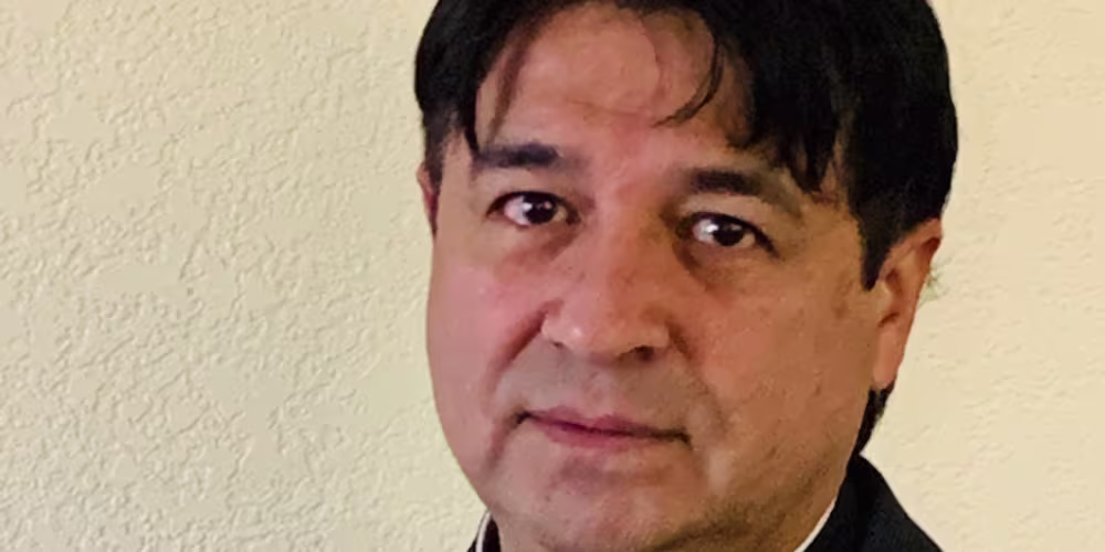 A headshot photo of Father Javier Arias