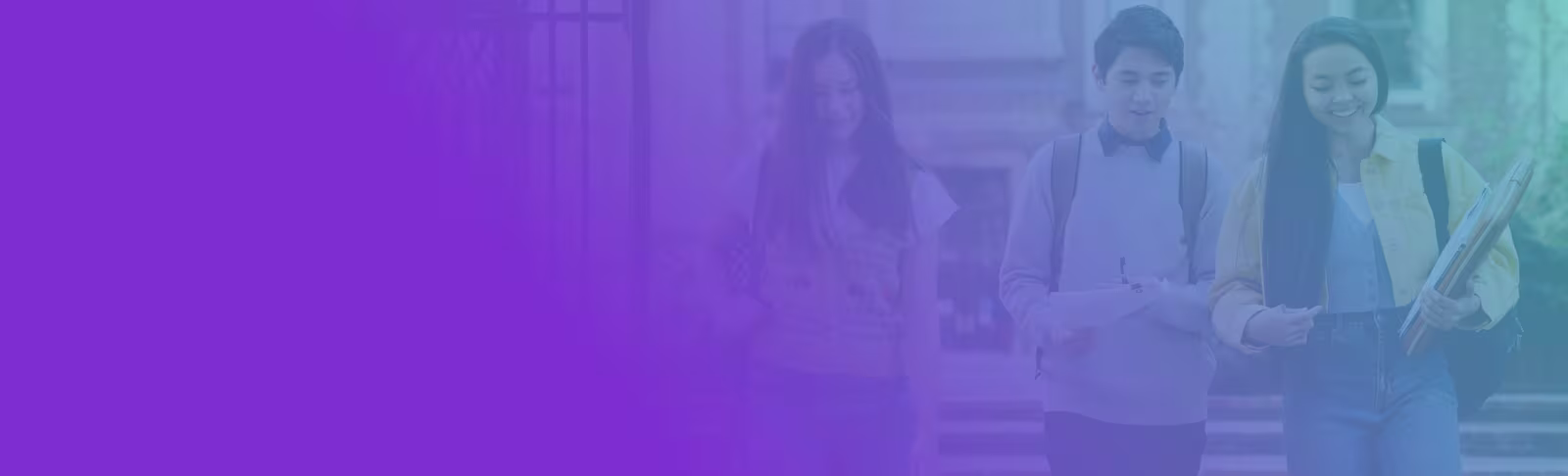 An image of three students walking on campus