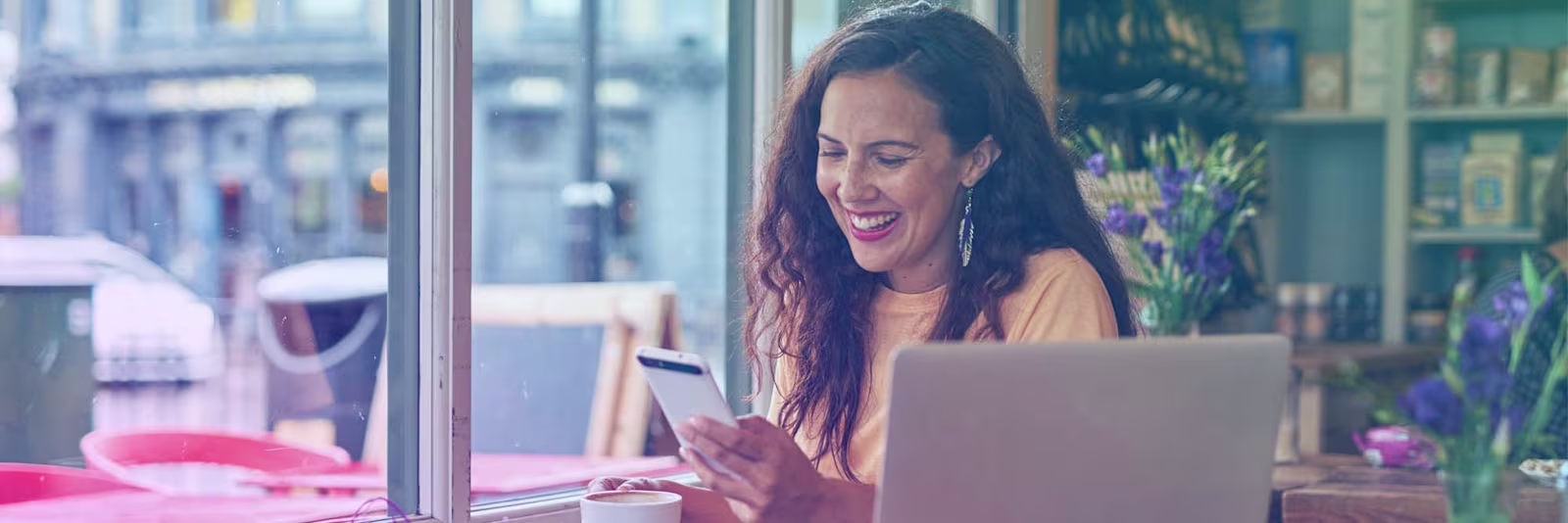 sending-money-to-yourself-header An image of a girl using her phone